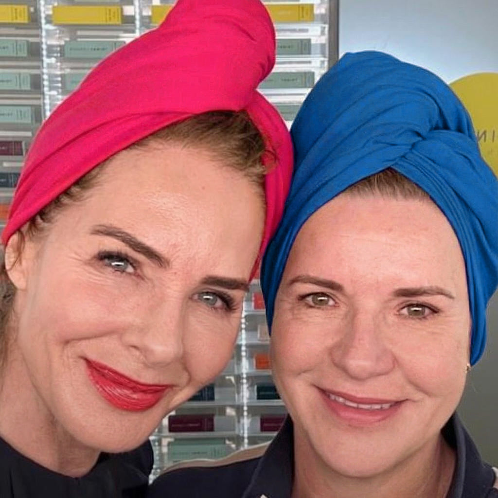Carla, founder of Good Wash Day, and Trinny Woodall wearing organic jersey cotton hair towels