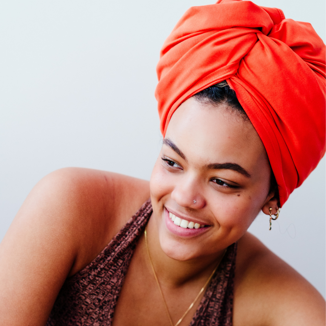 Good Wash Day blog why hair towel fabric matters with woman wearing organic jersey cotton hair towel