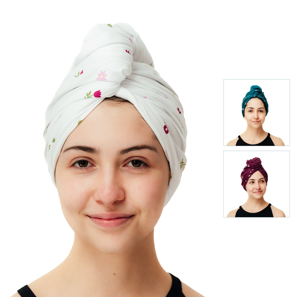 A young woman with a Good Wash Day Ditsy Prints organic jersey cotton towel-wrapped head smiles gently at the camera, set against a white background. Insets show her with different colored head wraps, ideal for sensitive skin.
