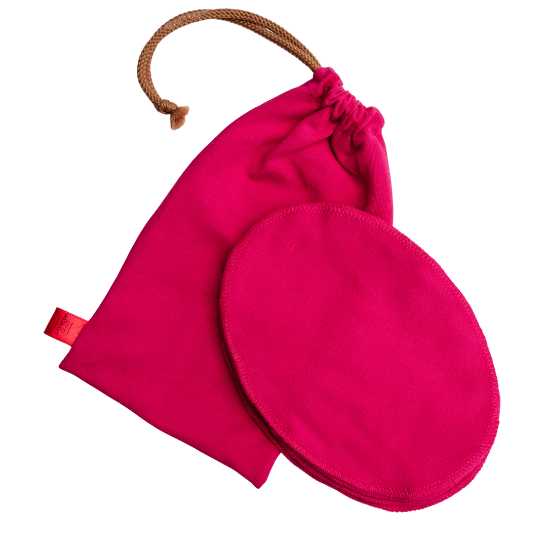The Good Wash Day Reusable Face Cloths - Pack of 7 + Bag - Small includes a matching eco-friendly bright pink round cloth pad and drawstring pouch made from organic jersey cotton, set against a white background.