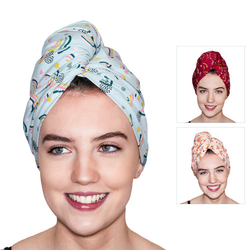 A woman wearing a light blue patterned turban-style headwrap is smiling. Insets show her in red and pink patterned headwraps. Handmade in the UK from organic jersey cotton towel, The Rainbows - PRE-ORDER by Good Wash Day are suitable for sensitive skin.
