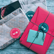 Pink Good Wash Day sustainable gift wrap with branded sticker