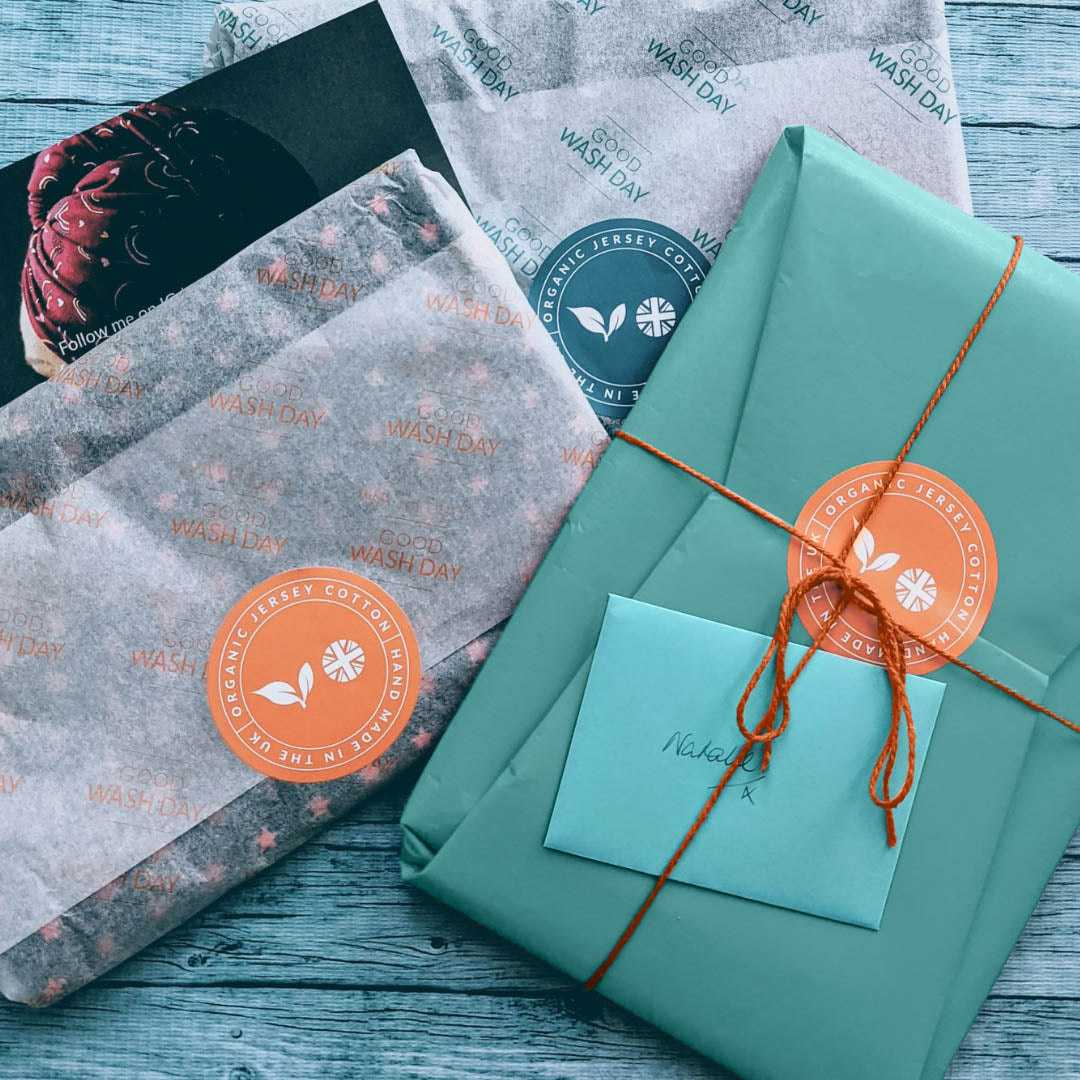 Teal Good Wash Day sustainable gift wrap with branded sticker