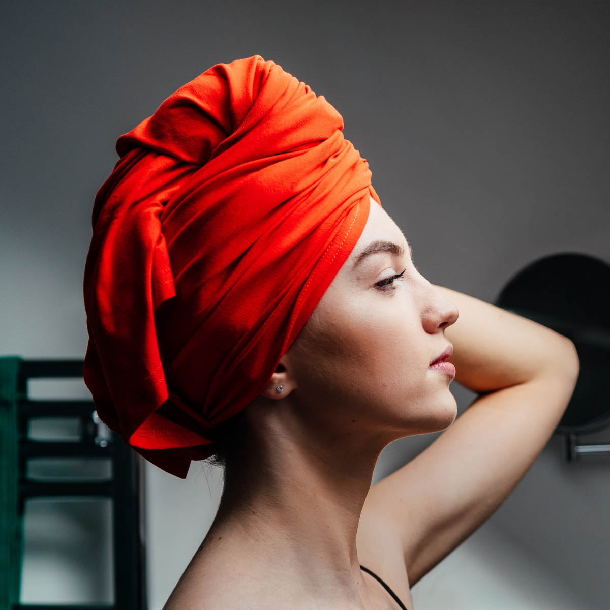 Woman wearing clementine orange organic jersey cotton hair towel wrap – Good Wash Day