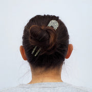 Woman wearing animal print French style hair pin to secure her long hair - Anna Butler
