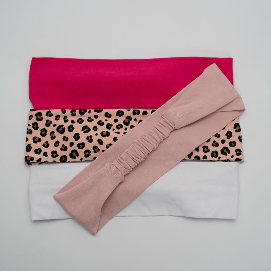 A selection of organic jersey cotton headbands in pinks and white | Good Wash Day