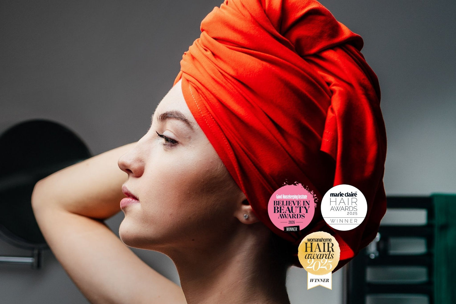 Woman in Good Wash Day award winning hair towel wraps with bagdges for best hair towel from Good Housekeeping, Marie Claire and Woman and Home