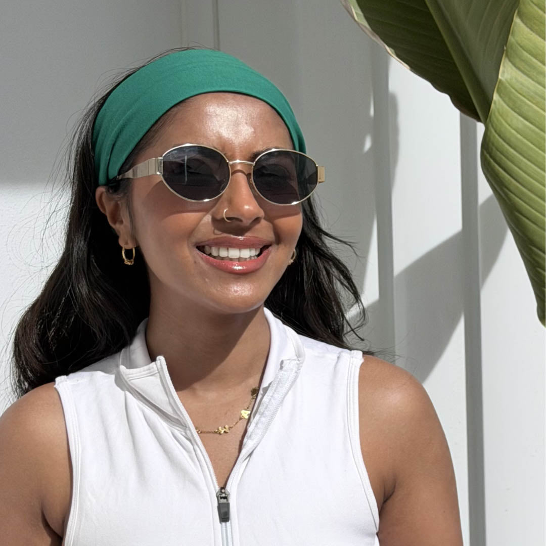 Woman with long straight hair wearing holly green jersey cotton headband – Good Wash Day