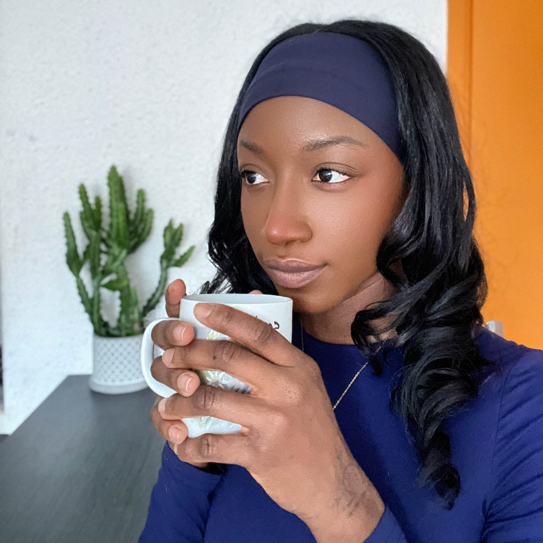 Woman wearing navy organic jersey cotton headband – Good Wash Day