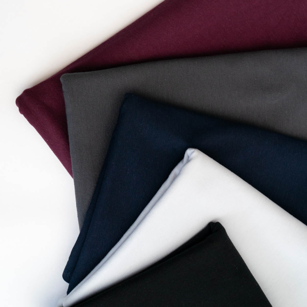 Folded organic jersey cotton hair towel wraps in neutral classic colours – Good Wash Day