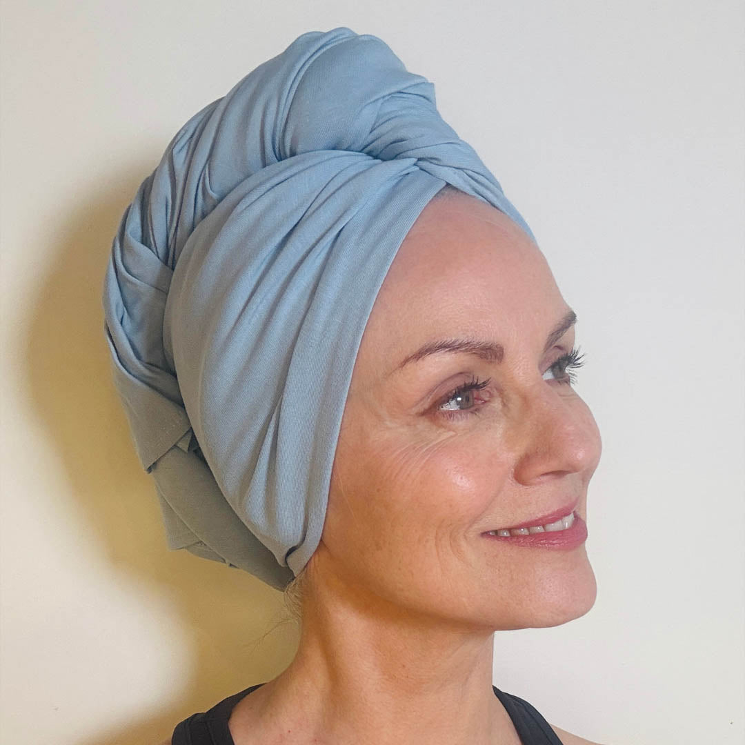 Woman wearing reduced price baby blue organic jersey cotton hair towel wrap – Good Wash Day