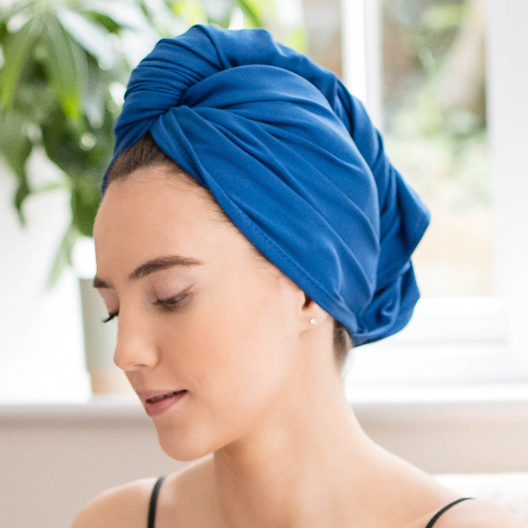 Woman wearing cobalt blue organic jersey cotton hair towel wrap – Good Wash Day