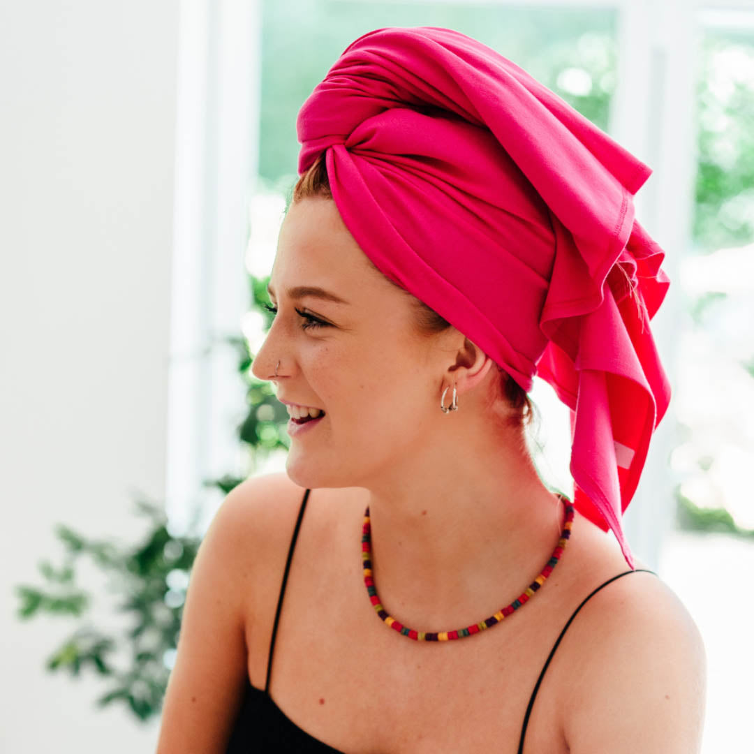 Woman wearing teal organic jersey cotton hair towel wrap – Good Wash Day