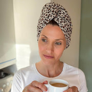 Woman wearing make-up and stone leopard print organic jersey cotton hair towel wrap – Good Wash Day