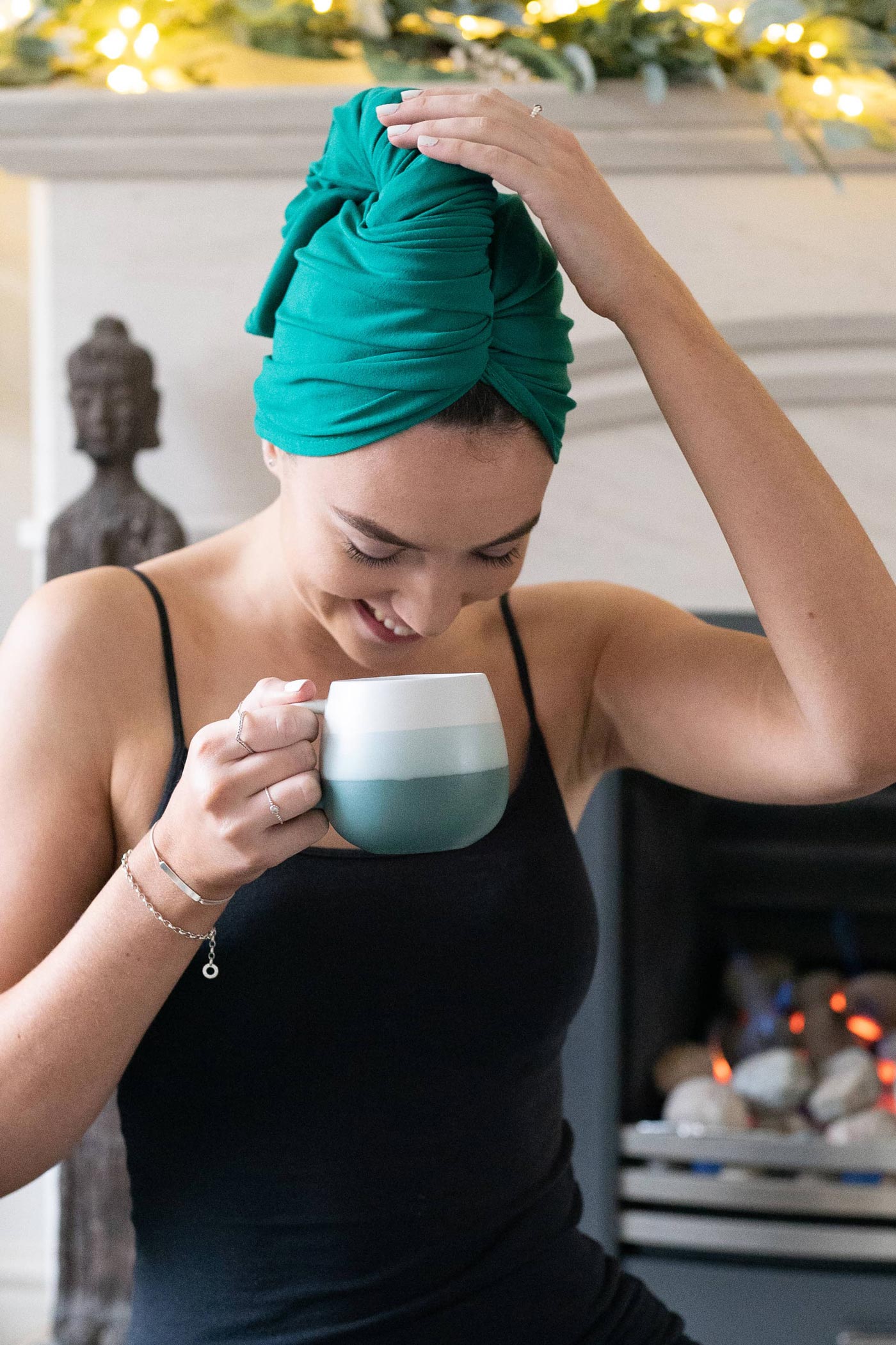 Woman wrapping hair in organic jersey cotton hair towel
