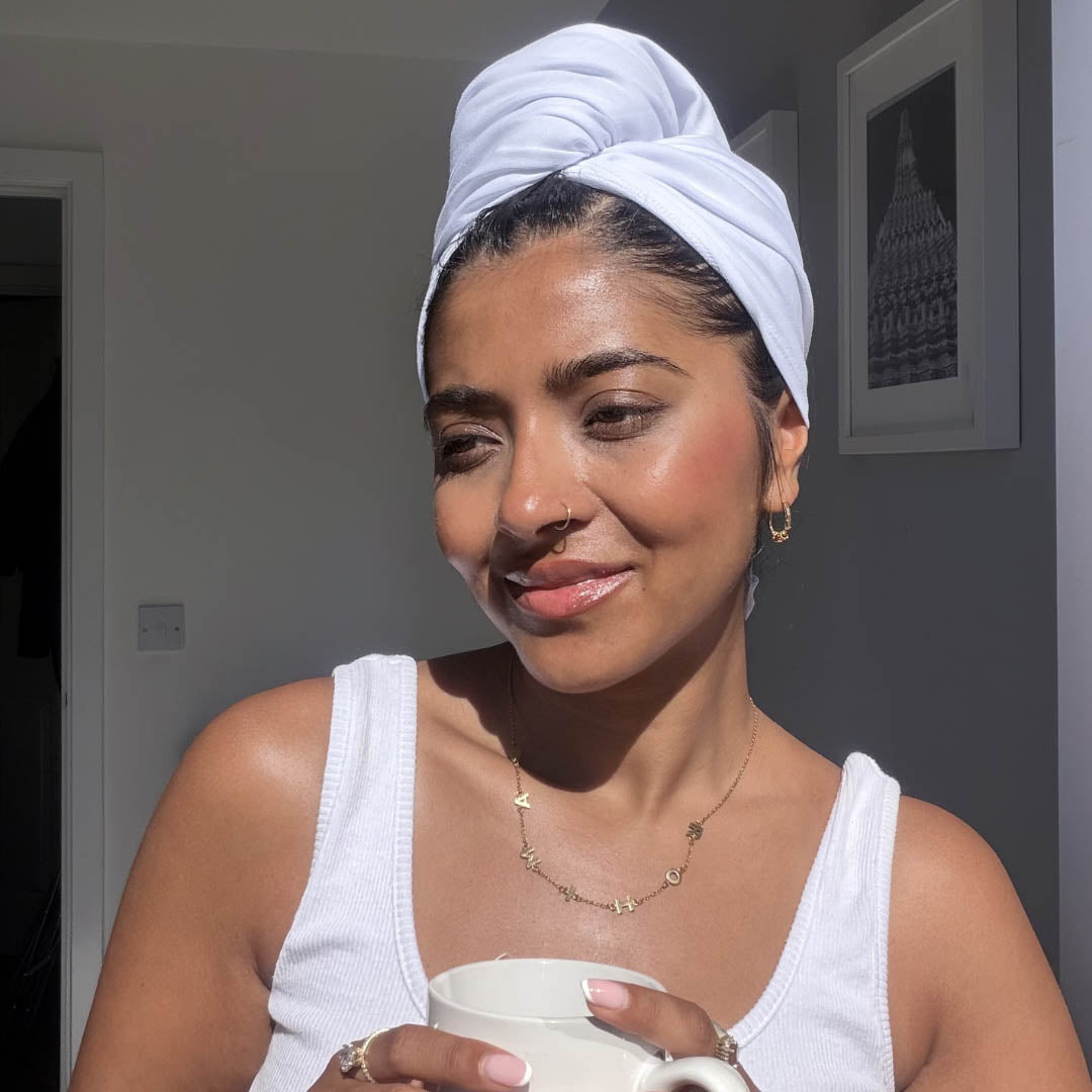 Woman drinking coffee and wearing white organic jersey cotton quick dry hair towel wrap – Good Wash Day