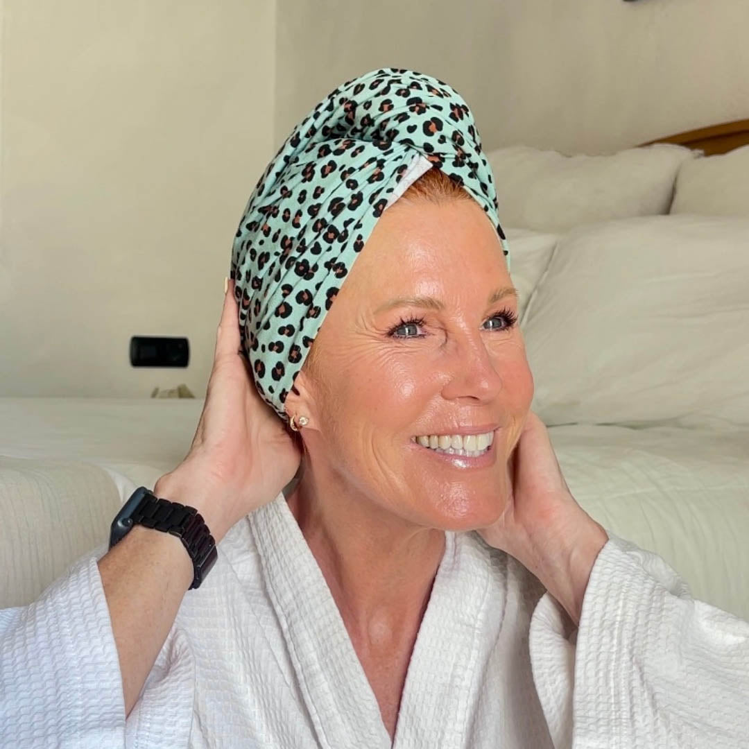 Woman in bathrobe wearing mint leopard print XL organic jersey cotton hair towel wrap – Good Wash Day