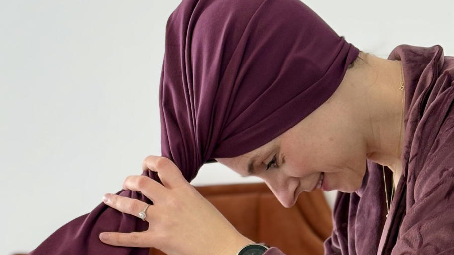 Woman wrapping hair with organic jersey cotton hair towel