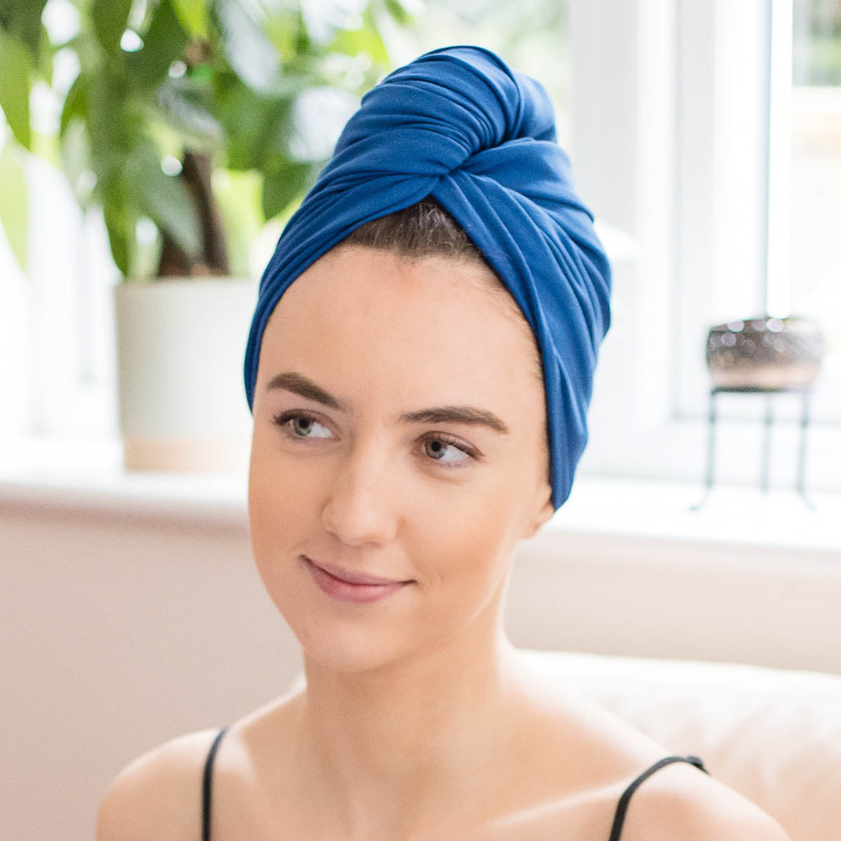 Woman wearing cobalt blue organic jersey cotton hair towel wrap outdoors – Good Wash Day